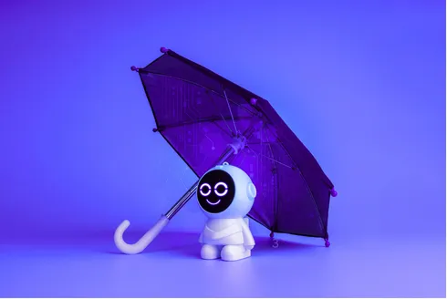A small robot figure sheltering under an umbrella — the protective framework structure this session builds